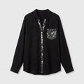 Blusa negra con detalles brillantes