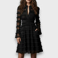 Vestido midi negro con flecos y transparencias