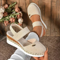 Sandalia beige de cuña acolchada