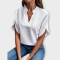 Blusa blanca de cuello en V y corte fluido